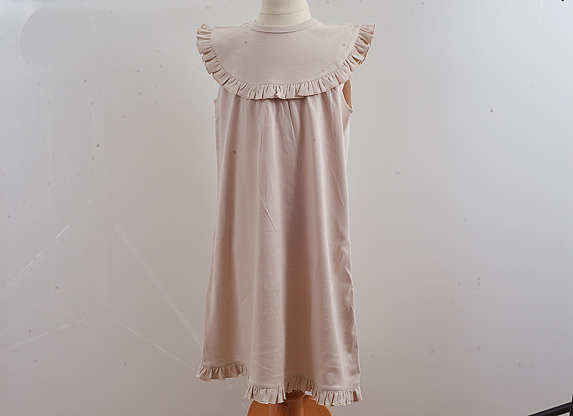 Blank, classic dress, sleeveless style. almond milk color.